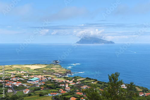 Bild auf Leinwand The coastal village of Ponta Delgada nestled on the green coast of Flores Island