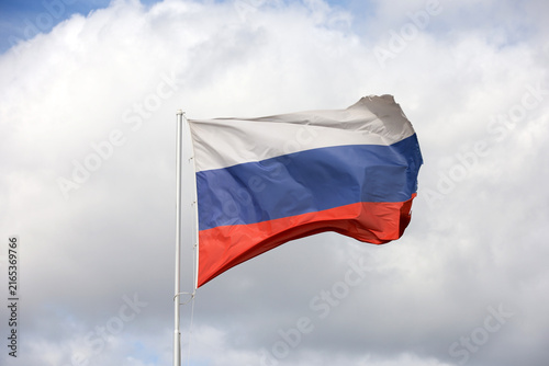 Bild auf Leinwand Russian flag waving against the sky with white clouds