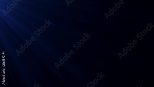 Canvas Print Subtle blue light rays descending from upper corner into dark mysterious minimalist black background