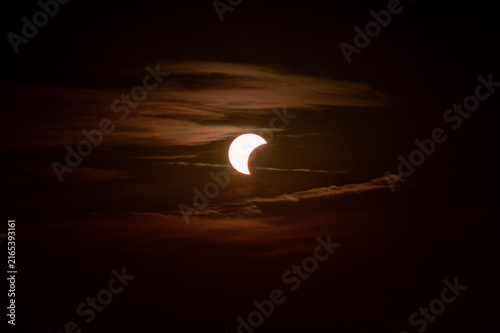 Eclipse Over Silhouetted seascape Tuscany  