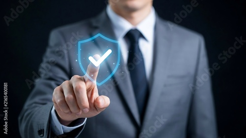 A corporate professional interacting with a glowing digital security shield icon representing data protection and cybersecurity