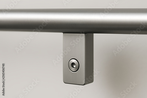 Close-up of modern brushed metal railing bracket with minimalist industrial design