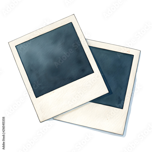 Two blank instant photo prints on a table, ready for memories.