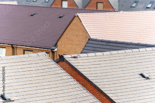 Sticker Close Up View of Residential House Roofs With Tiled and Shingled Surfaces in Sub