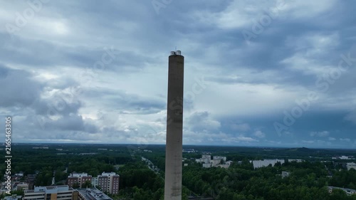 Cinematic drone footage of Pohjois-Haaga, featuring the Helen Tower and Kannelmäki in Helsinki, Finland, filmed on a cloudy summer day.