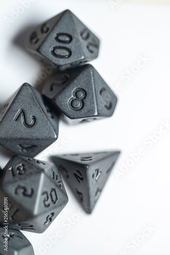 Fotografie Black polyhedral dice for roleplaying games The Concept of fantasy adventure