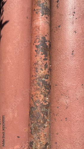 Rusty red metal pipes close-up texture