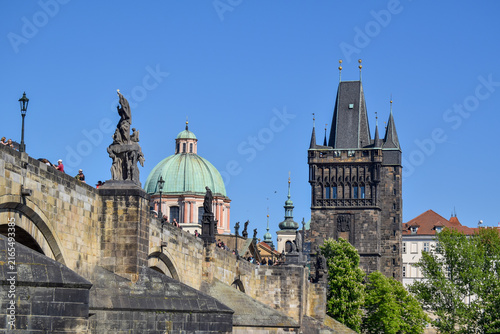 Photography A scenic view of Prague’s historic Charles Bridge, with  Old Town Bridge Tower and St