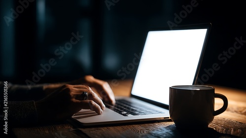 Person Typing on Laptop at Night with Coffee Mug – Focused Late Night Work and Study Concept