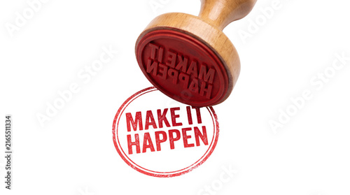 Wooden rubber stamp with the phrase Make It Happen in red ink.