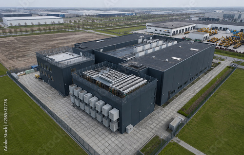 Aerial View of Modern Computing Facility with Rooftop Cooling Equipment and Industrial Buildings