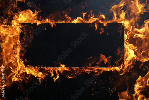 A dramatic composition featuring a rectangular void surrounded by intense flames against a dark background.