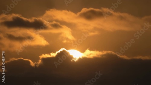 a high quality stock video about Sun disappearing behind clouds