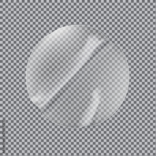 A close up view of a transparent sticker peel being lifted from a smooth surface with light reflection