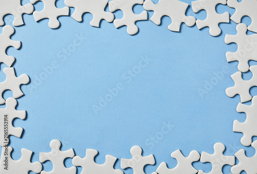 Puzzle border on blue background