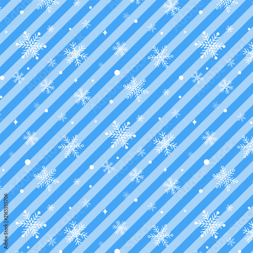 Christmas seamless pattern with white snowflakes on pastel blue diagonal stripes.Xmas, new year repeat pattern.Winter background wallpaper.