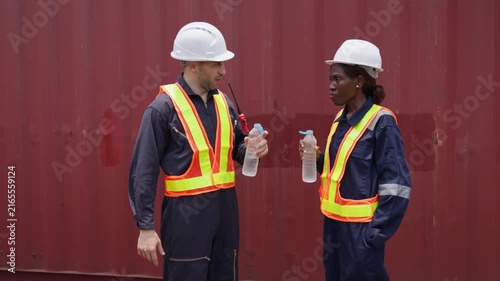Engineers discussing hydration and safety while on break outdoors