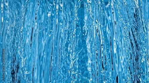 Blue water curtain cascade flowing streams abstract texture background horizontal