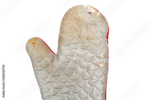 Old worn oven mitt with stains and weathered fabric isolated on white.