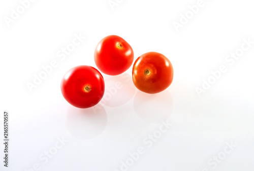 Canvastavla Three Cherry tomatoes isolated on white background