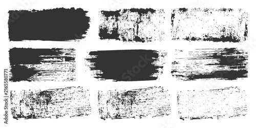 A collection of nine grungy, textured brush strokes and smudges in black and white, perfect for adding a distressed or artistic flair to graphic designs.