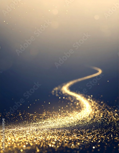 Golden glitter light trail forming a winding path with glowing particles on dark background