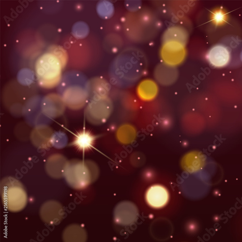 Warm bokeh lights and glowing particles on dark red abstract background
