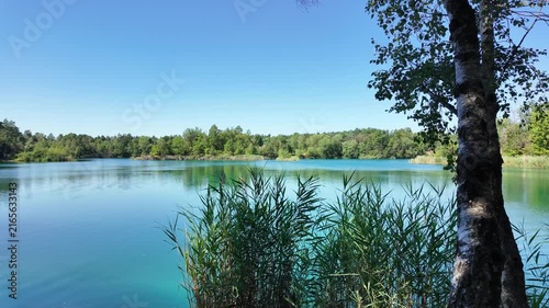 idyllic lake landscape near Pretzien, Saxony-Anhalt, Germany; three former quartzite quarries, deep lake, blue lake, quarry lake, popular diving area 