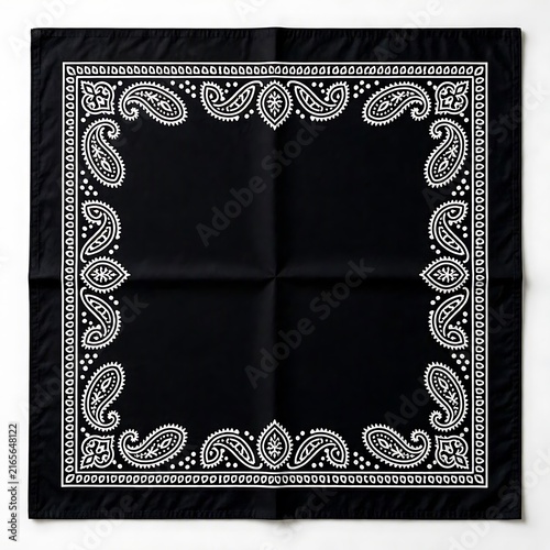 Black bandana with white traditional paisley pattern displayed flat on surface