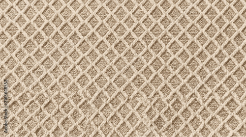 Close-up of a beige knitted fabric with a diamond-shaped pattern textile knitting