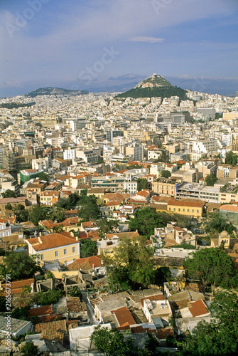 View of Athens from Acropolis with Mont Lycabettus in the background overlooking cityscape and rooftops in the Attica region of Greece