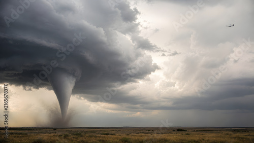 Tornado Developing Beneath Supercell With Distant Aircraft