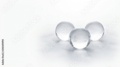Tapety artystyczne Three clear glass spheres on a white background