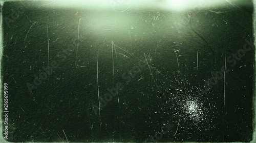 Vintage Film Texture with Scratches Dust and Light Leaks on Dark Green Background