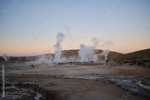 Canvas Print Geysers del tatio erupting steam in early morning light