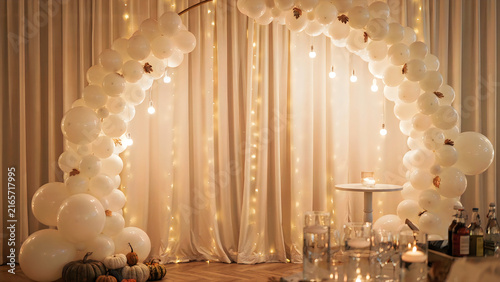 Elegant Halloween wedding reception with white draped curtains and floating ghostly decor