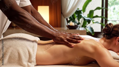 Soothing Back Massage: A tranquil scene of a therapeutic massage, with skilled hands working to relieve tension and promote relaxation on a client's back.