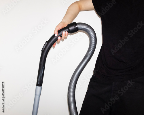 Person cleaning hoovering vacuuming with vacuum cleaner and hoover