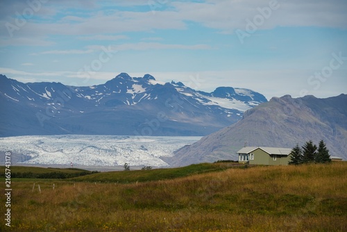 Photography Buildings with mountains in the background near the town of Hofn in Iceland