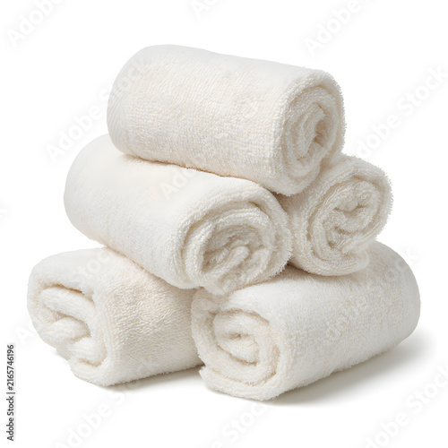 A stack of neatly rolled, soft white towels, perfect for a spa or home bathroom setting.