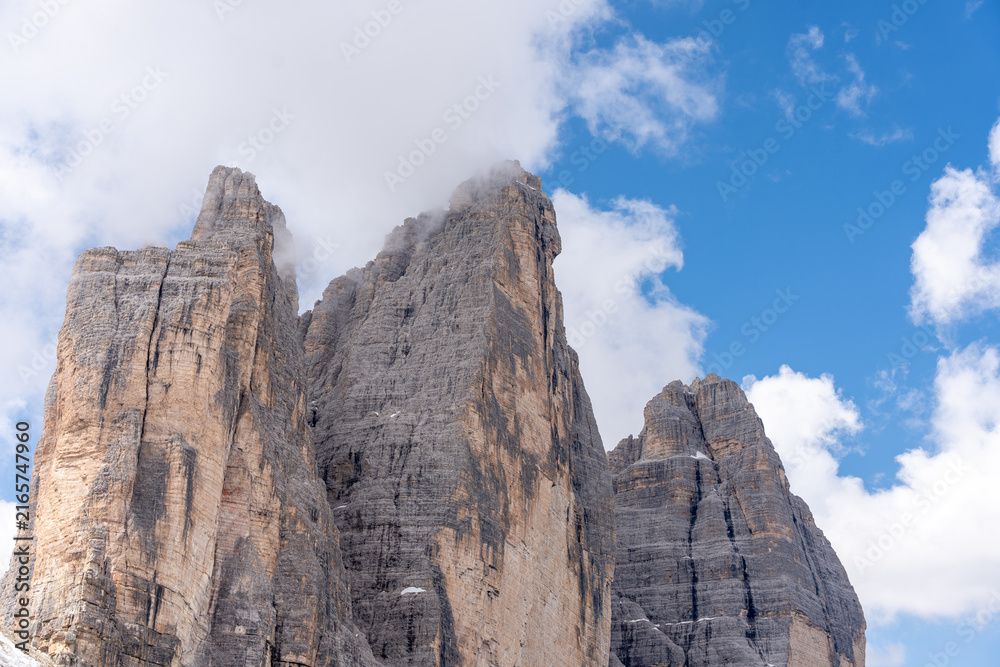 Fototapeta premium Three Peaks of Lavaredo Dolomites clouds covering summit