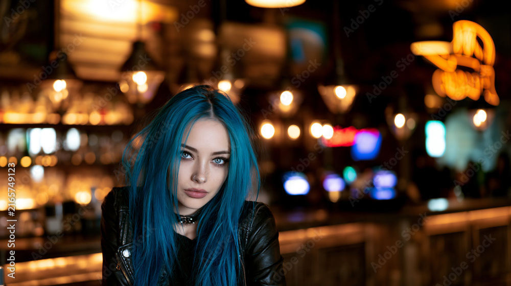 Fototapeta premium blue haired woman entering a stylish bar, beautiful blue haired woman at a nightlife bar, attractive woman with blue hair in a modern bar