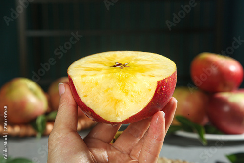 Canvastavla Fresh Yanyuan Apple Slice from Yunnan China Held in Hand Showing Sweet Juicy Int