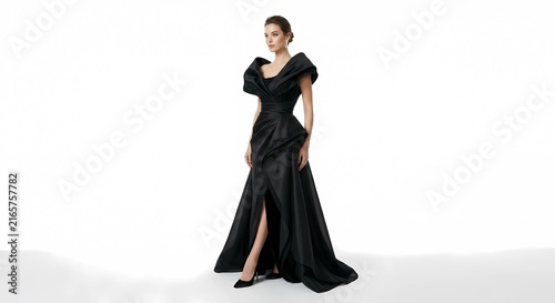 Tapety artystyczne Elegant black haute couture evening gown with sculptural silhouette on white background
