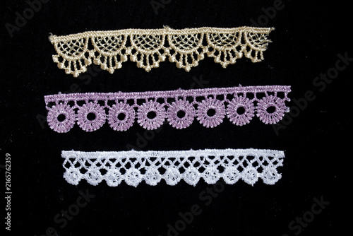Fotografie Assortment of colorful decorative lace trims for sewing and crafting projects