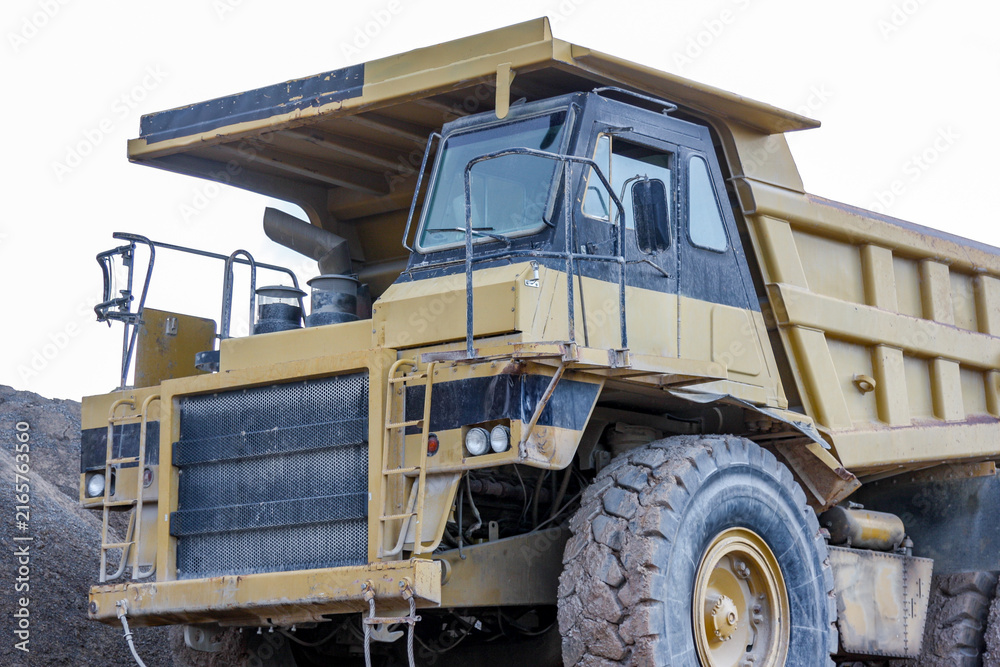 Fototapeta premium Heavy duty mining dump truck operating in quarry