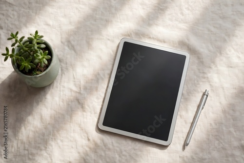 Natural Tablet With Potted Plant And Pen