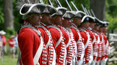 Soldiers in Red Uniforms Get Ready for a Revolutionary War Reenactment