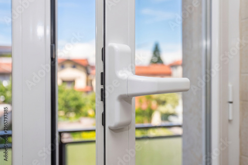 White Window Handle with Outdoor View
