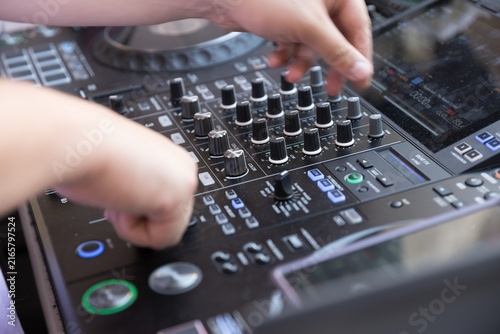 DJ Hands Operating Professional Mixing Console